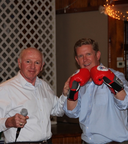 Pictured from left, National Committee to Preserve Social Security and Medicare President and CEO Max Richtman presents 12th Congressional District candidate Brendan Kelly with a pair of boxing gloves while encouraging him to fight for Social Security and Medicare if elected. (James “Tal” Moss photo)