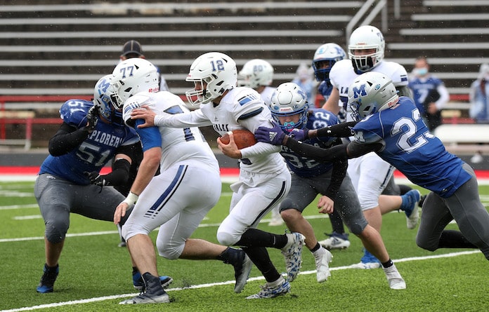 Columbia quarterback Dominic Voegele picks up yards against Alton Marquette on Saturday, April 24, 2021 . Paul Baillargeon, Special to the Republic Times.