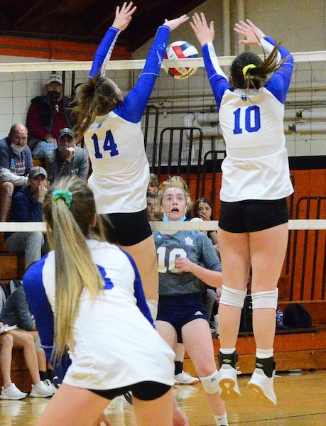 Gibault’s Emma Schmidt (center) reacts as Springfield Lutheran players score a point at the net during Friday’s supersectional. See more photos from the match at republictimes.smugmug.com.