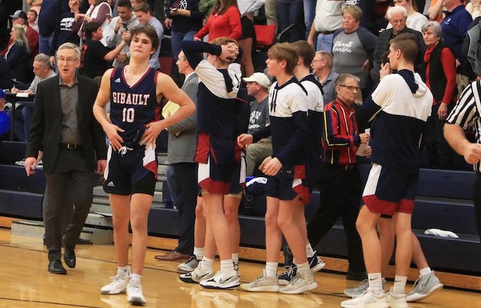 Kaden Augustine (10) and the Gibault Hawks feel the stink of a last second defeat against Liberty at the Class 1A North Greene High School sectional semifinal boys  basketball in White Hall, Illinois on Tuesday March 1, 2022.