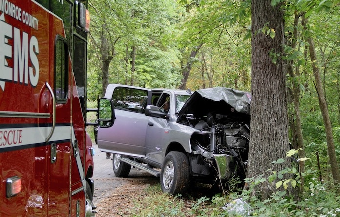 Truck strikes tree west of Red Bud