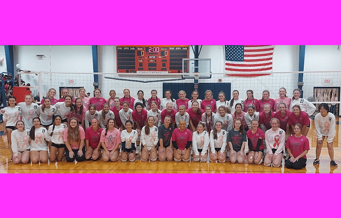 Volleyball rivals go pink