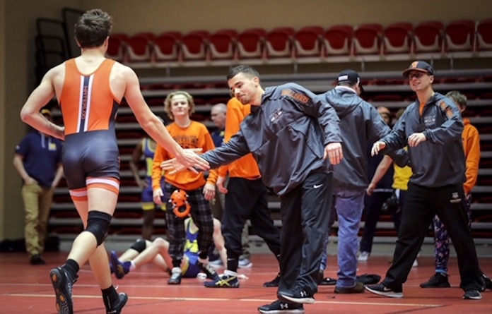 February 4, 2023 - Centralia, IL - Waterloo’s Nathan Lloyd is congratulated by his coaches and teammates after defeating  Mascoutah’s Joseph Moore in the 3rd place match at the IHSA 2A, Centralia Regional Wrestling tournament.  Lloyd’s win will advance him to next week’s Sectional tournament in Highland . Photo:Chris Johns