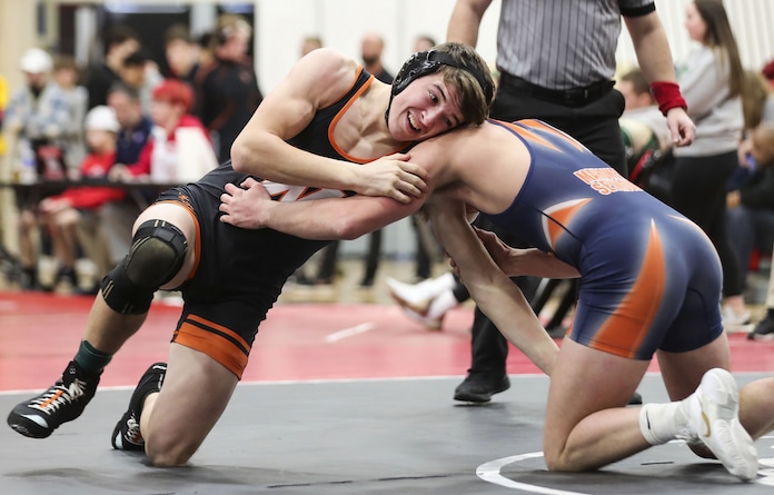 February 11, 2023 - Highland, IL - Waterloo's Nathan Lloyd  wrestles Mahomet Seymour's Cale Hillard during the Highland, IHSA 2A, Sectionals.  Photo:Chris Johns