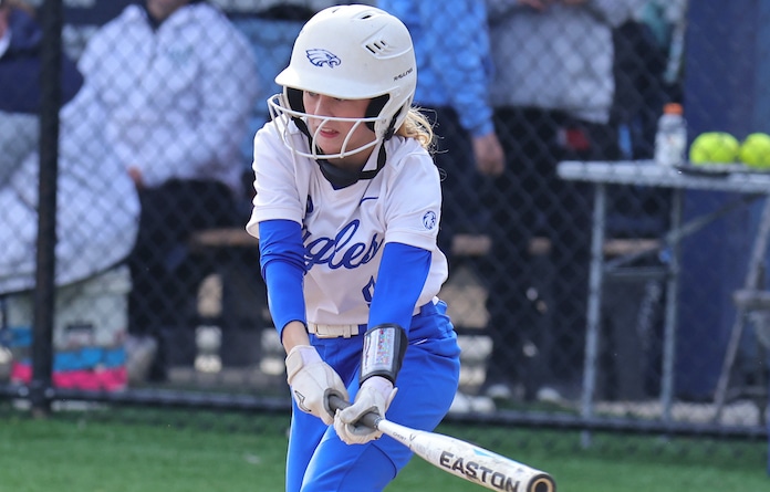 Elle Van Breusegen of Columbia bunts the ball into play against Belleville East in a game at Belleville East High School in Belleville, Illinois on Friday, April 7, 2023. Paul Baillargeon / STLhighschoolsports.com