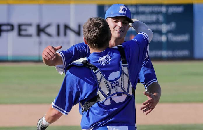 June 2, 2023 - Peoria,  - Columbia catcher Brennan Weik and pitcher Dominic Voegele celebrate after Friday’s 9-0 win over Depaul in the IHSA 2A, state semifinal game at Dozer Park in Peoria.  Columbia’s advances to the championship game.  [Photo: Chris Johns]