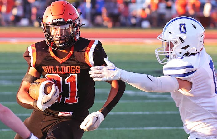 Derez Sayles of Waterloo picks up yardage against Cameron Janik of Columbia at Waterloo High School on Friday, September 1, 2023. Paul Baillargeon