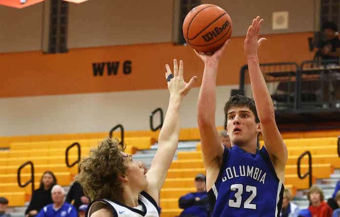 Sam Donald (32) of Columbia takes a  three point shot against Mater Dei in a second round game of the Wesclin Tip- Off at Wesclin HIgh School on Tuesday, November 21, 2023. Paul Baillargeon
