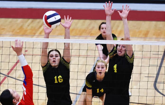Violet Krekel (16) and Brooke Miller (4) of Valmeyer go up for a block against St. Anthony in the Class 1A Sectional final at Nokomis High School on Wednesday November 1, 2023. Paul Baillargeon