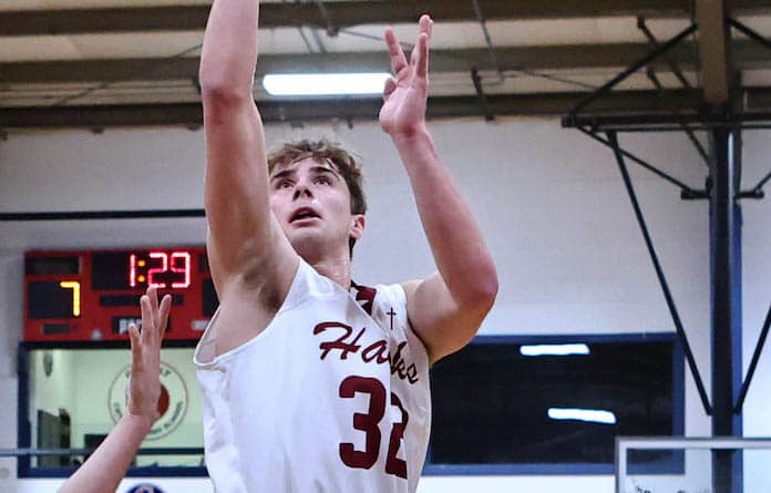 Gavin Kessler (32) of Gibault takes a shot against Routte Catholic at Gibault High School on Saturday, December 2,