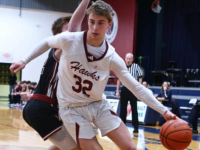 Gavin Kesler of Gibault drives to the basket against Red Bud in a game on Saturday, January 27, 2024 at Gibault High School in Waterloo, Illinois.