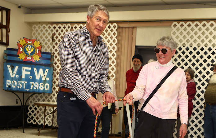 Mike Harres with two of his furry friends and Jackie Jenson at the Appreciation Celebration day to say thanks to DMV Mike Harres at the VFW in Millstadt on February 10, 2024.