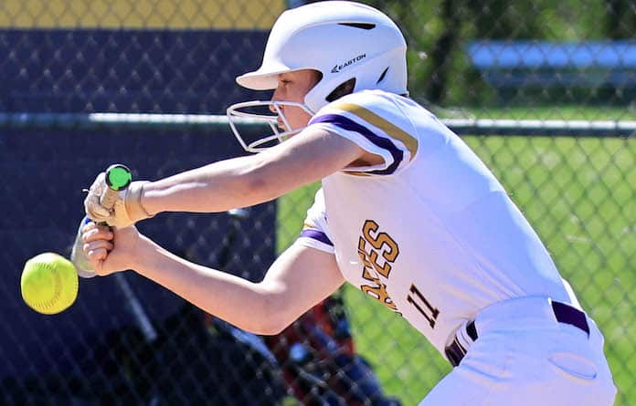 Hannah Gideon (11) of Valmeyer gets the bunt down against Waterloo in a softball game at Valmeyer High School on Saturday, April 20, 2024.