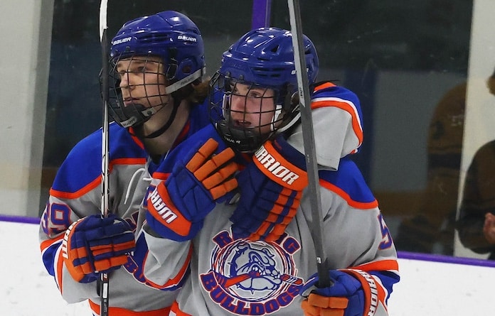 Layne Wilkens (39) and Parker Stoll (5) celebrate a goal against O'Fallon at the McKendree Metro Rec Plex on Tuesday, January 21, 2025 in O'Fallon, Illinois. Paul Baillargeon