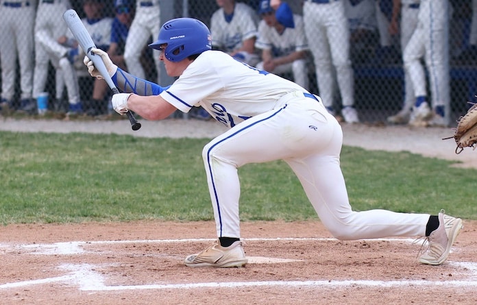 Sully Bonaldi of Columbia lays down the bunt against Waterloo at the Columbia Middle School in Columbia, Illinois on Friday, March 28, 2025.