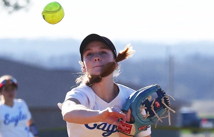 Kaylee Busch (2) of Columbia throws to first base for the out against Gibault at Gibault High School in Waterloo on Monday March 17, 2025.