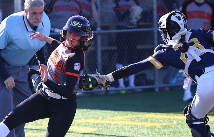 Ava Brown (6) of Waterloo avoids the tag from Alli Janning (23) of O'Fallon and scores at the O'Fallon Millburn Campus on Wednesday March 26, 2025.