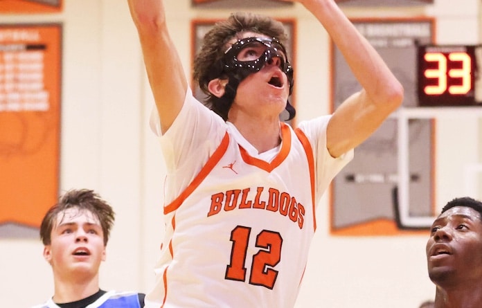 Tyler Devilder (12) of Waterloo goes up high to drop in a basket against Sparta at Waterloo High School on Monday November 25, 2025. Paul Baillargeon