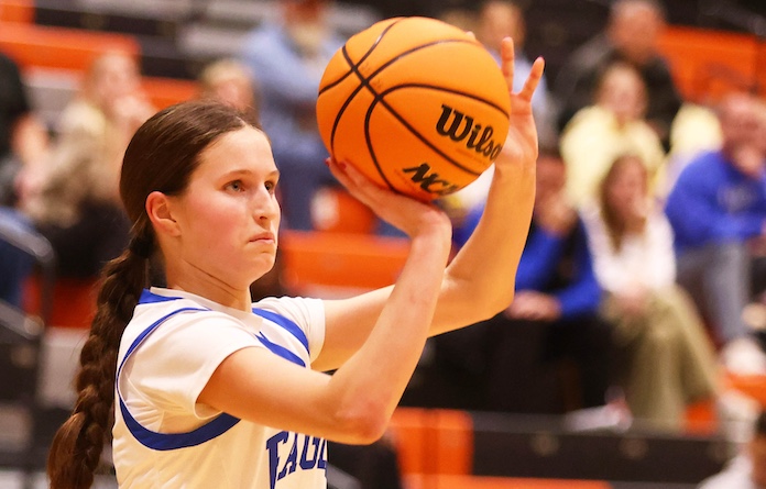 Addison DeWilde (21) of Columbia takes a three point shot against Marquettte in day 2 of the Waterloo High School Girls Holiday Tournament in Waterloo on Saturday December 27, 2025. Paul Baillargeon
