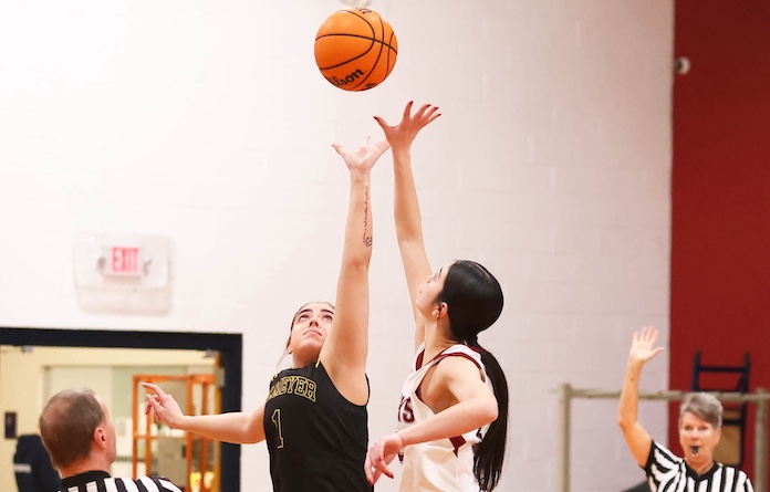 Kaleigh Hicks (1) of Valmeyer and Karmon Grohmann (12) of Gibault jump for the opening tip in a non conference girls basketball game at Gibault Catholic High School in Waterloo, Illinois on Tuesday January 20; 2026. Paul Baillargeon