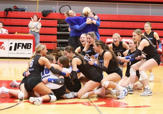 The Columbia Eagles come off the bench to celebrate to defeat Rochester at the Vandalia Super-Sectional on Monday November 10, 2025.