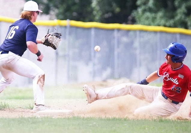 Waterloo players slides into third base safley as the third baseman Owen Hawkins (16) of Godrey awaits the ball in game 1 of a doubleheader in Mon Clair League action on Sunday June 29, 2025 in Waterloo.
