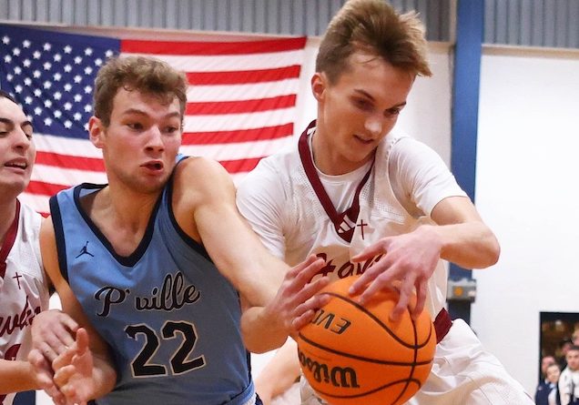 Colby Kincheloe (20) of Gibault fights for a rebound against Pinckneyville in a boys basketball game at Gibault High School in Waterloo, Illinois on Saturday January 2026. Paul Baillargeon