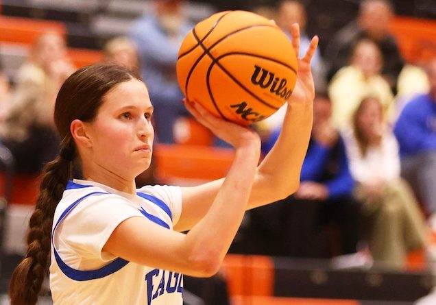 Addison DeWilde (21) of Columbia takes a three point shot against Marquettte in day 2 of the Waterloo High School Girls Holiday Tournament in Waterloo on Saturday December 27, 2025. Paul Baillargeon